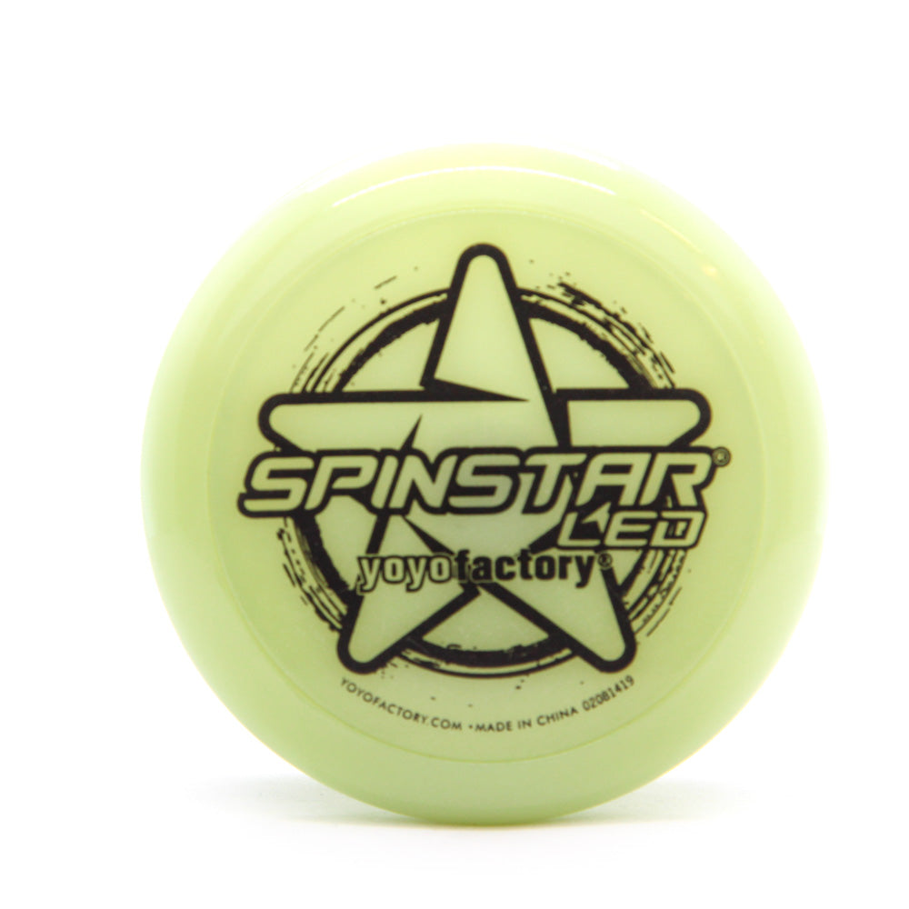 yoyo with glow-in-the dark body and black writing on the side