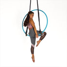 performer sitting in 2 point aerial hoop