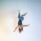 image of a performer on a white rope in a wrap known as isle of mann