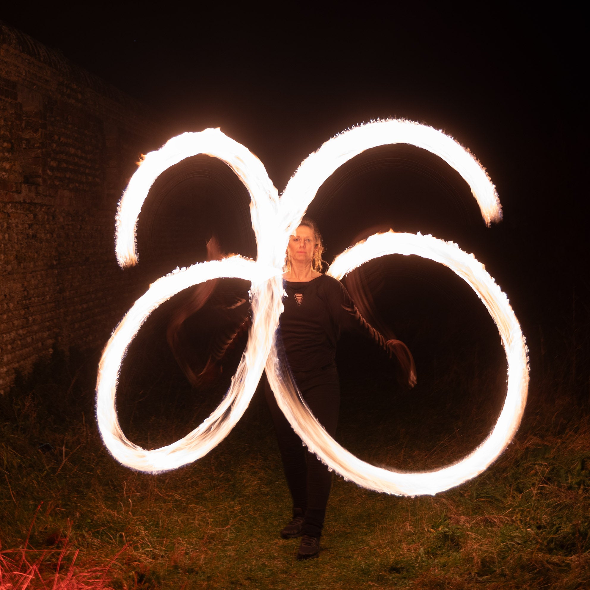 performer with fire poi