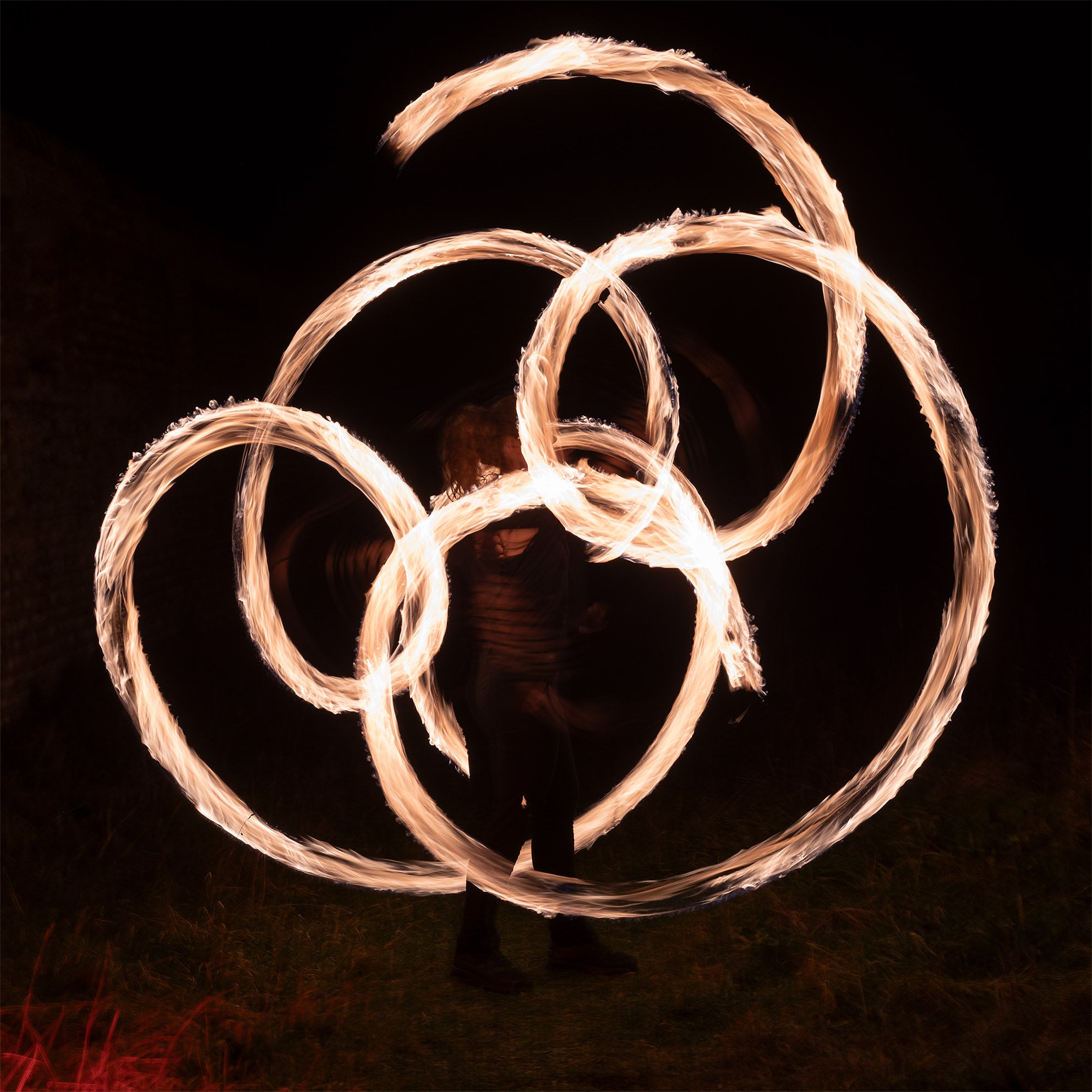 performer with fire poi