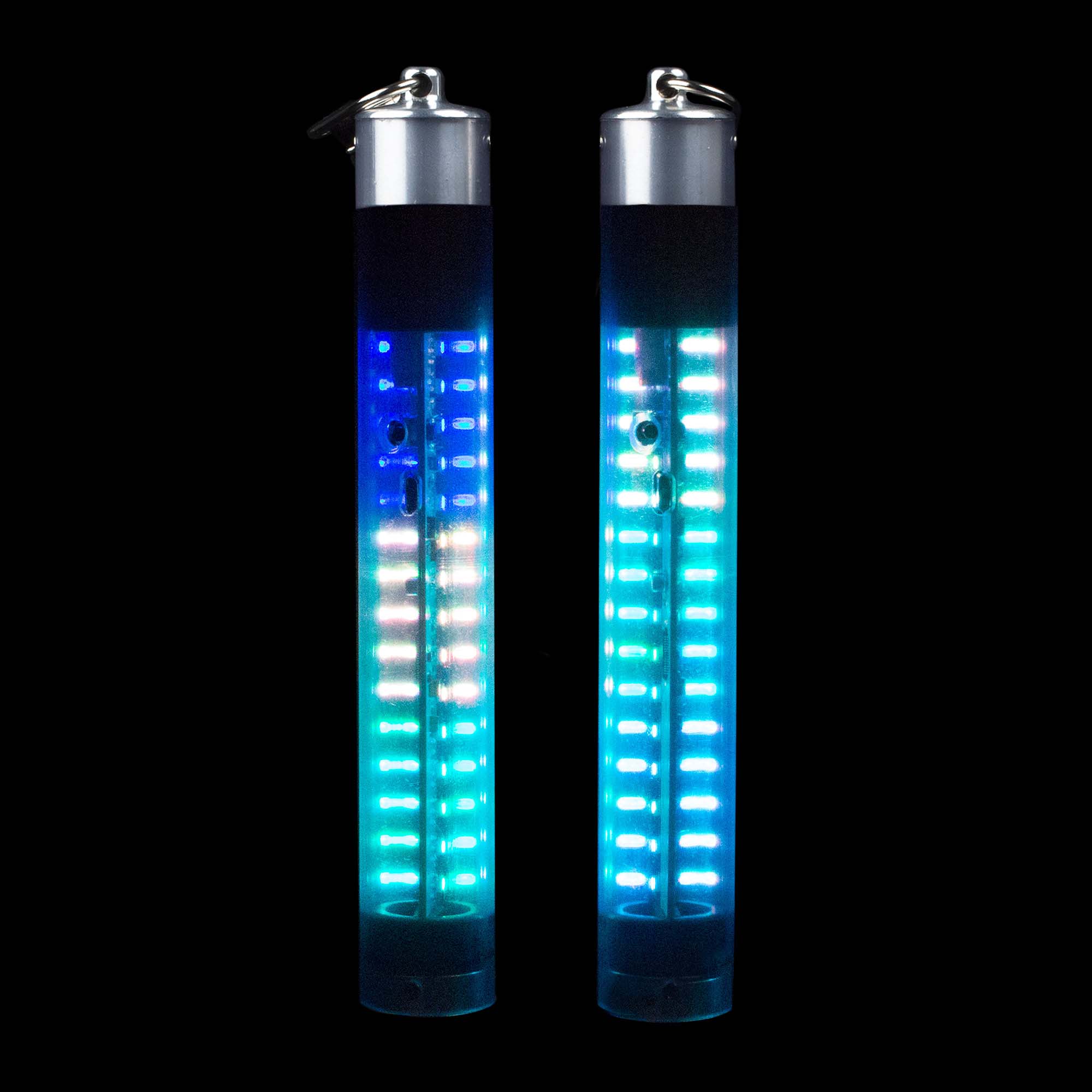 Lumin-Art Pixel Stick standing like candles and glowing with lots of lights along the length of the tube.