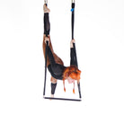 performer on shackle trapeze